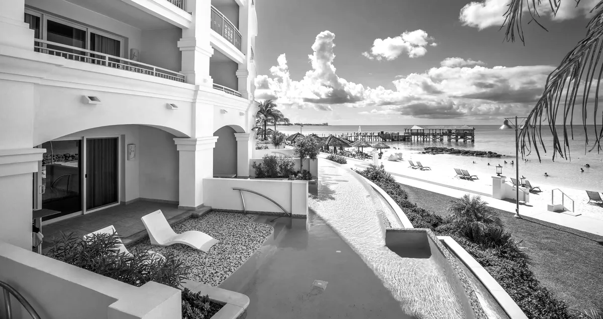 Walkway between resort buildings leading down to the beach
