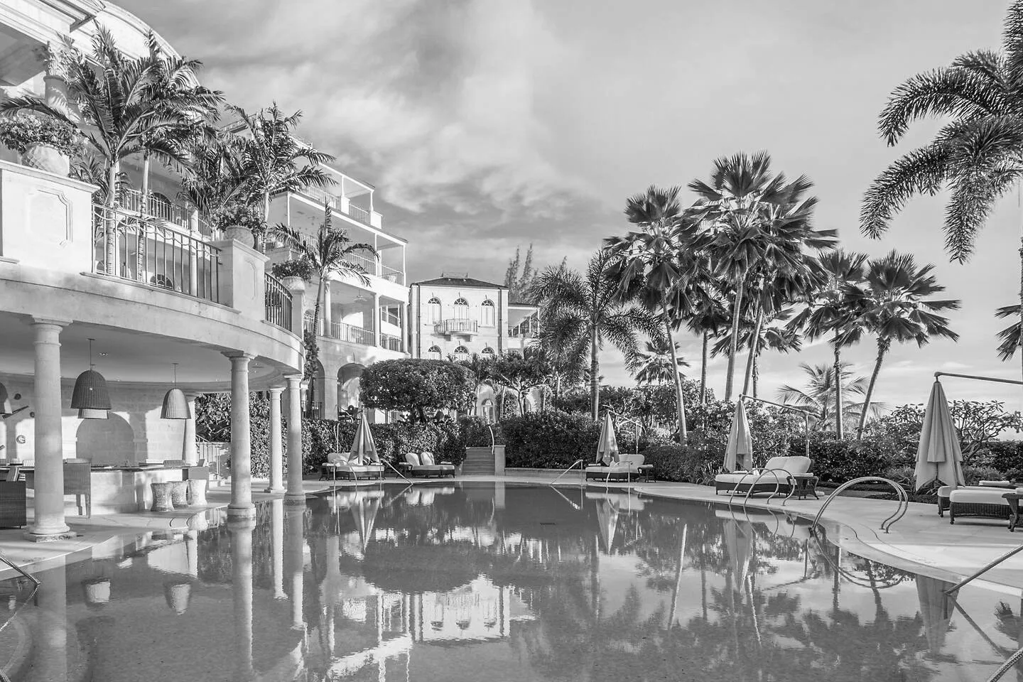 Poolside terrace and palm trees at a resort